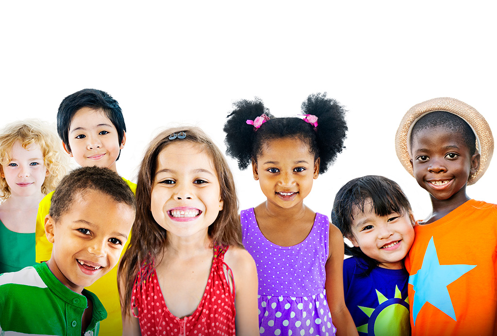 A group of foster care children posing in front of a white background.