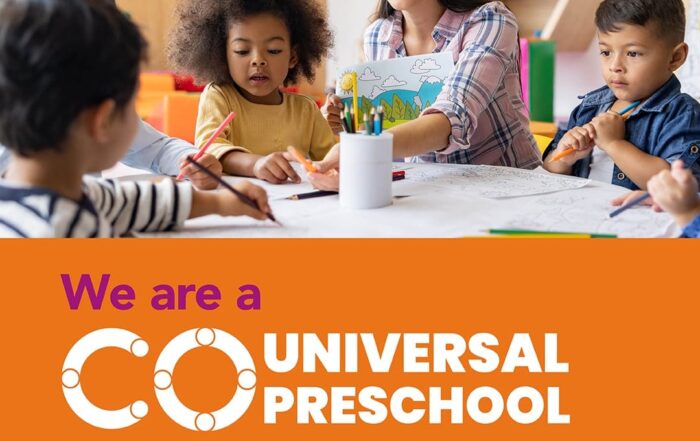 Teacher and three young children engaging in coloring activities around a table in a colorful classroom, with text stating "we are a universal preschool provider.